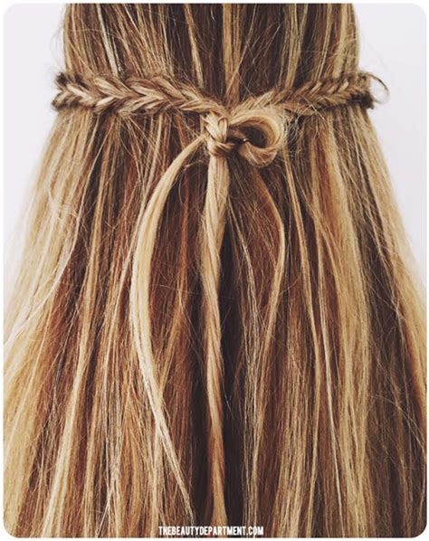 Wrap the twisted hair around the base of the ponytail to create a bun. PHOTOS/POST BY KRISTIN ESS