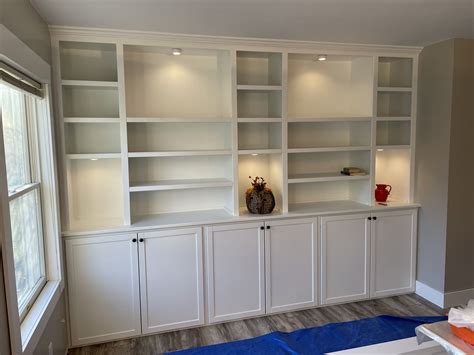 Hand Crafted Built In Wall Shelving With Base Cabinet With Doors By The