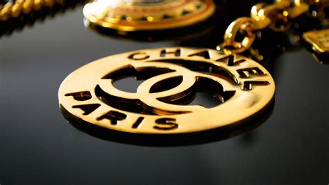 Download Gold Chanel Logo Pendant Wallpaper