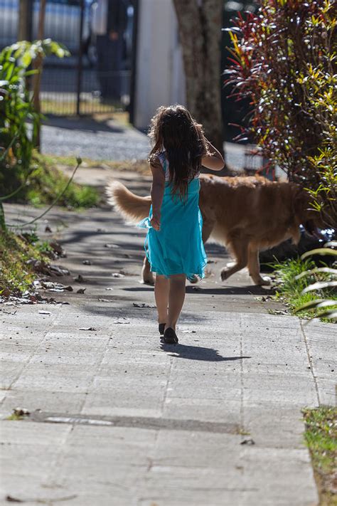 Young Girl Walking Her Dog Photograph By Craig Lapsley
