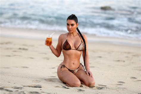 Kim Kardashian Shows Off Her Curves In A Snakeskin Print Bikini After Filming Kuwtk In Malibu