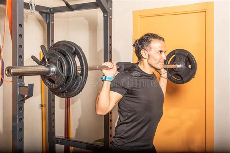 Close Up Of Sportsman Doing Squats With Bar At Gym Stock Image Image Of Effort Squat