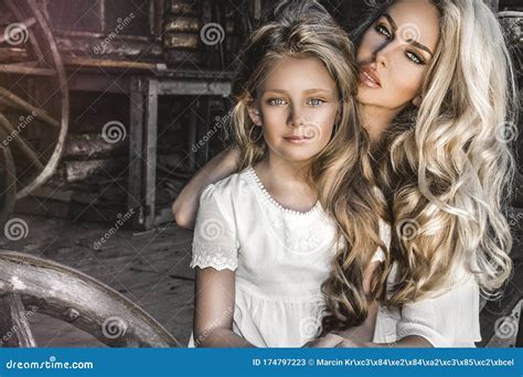 Portrait Of Cheerful Mother And Daughter Joyful Mother And Daughter Hugging And Enjoying A