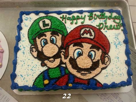 Birthday cake with nintendo as a cake topper, decorated with scenes from super mario brothers on the sides.check out my cookbooks with easy recipes for busy. Buttercream super Mario brothers birthday cake | Mario ...