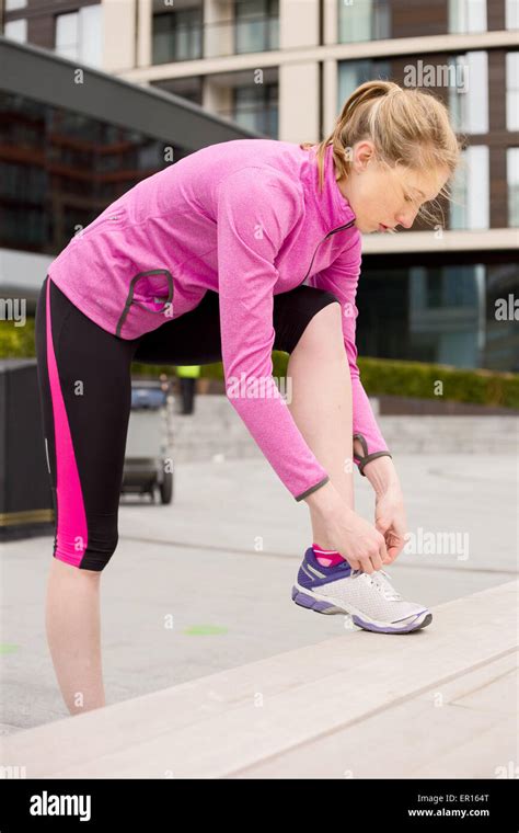 Lady Tying Shoe Lace Running Hi Res Stock Photography And Images Alamy