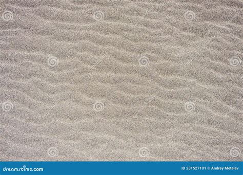 Gray Sandy Background With Waves Texture Of Fine Sand Stock Image
