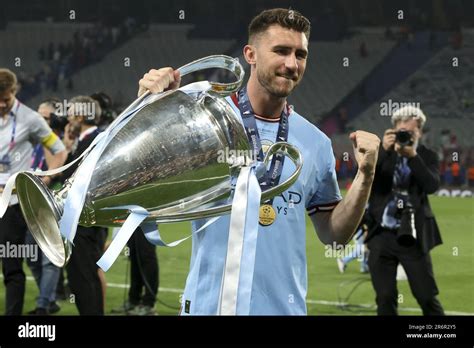 Aymeric Laporte of Manchester City celebrates with the trophy following