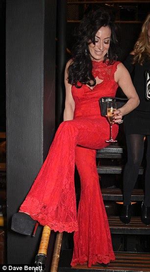 nancy dell olio turns heads in a backless racy red lace jumpsuit daily mail online