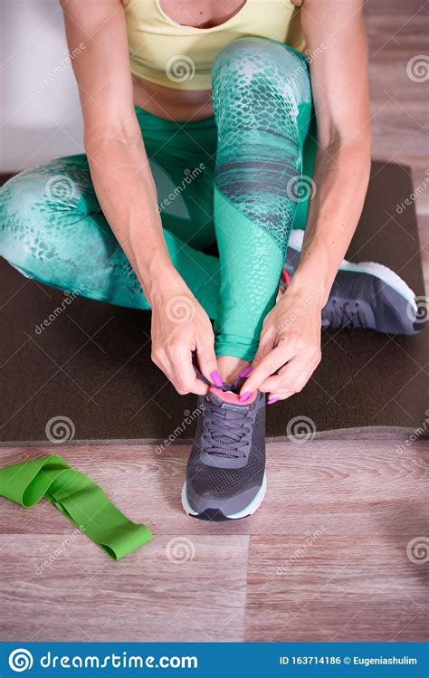 Sports Woman At The Gym Doing Stretching Exercises And Smiling On The Floor Stock Photo Image