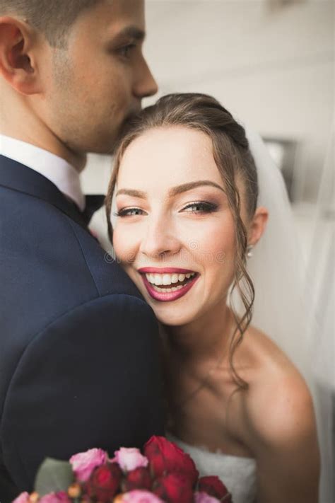 Portrait Of Happy Newly Wedding Couple With Bouquet Stock Photo Image