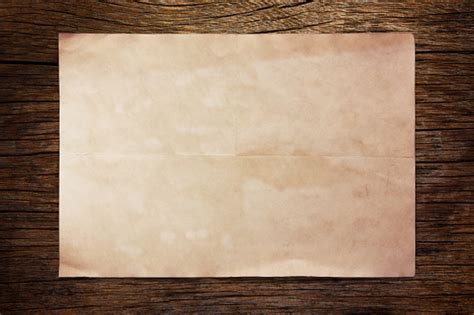 Old Paper On Wooden Table Stock Photo Download Image Now Istock