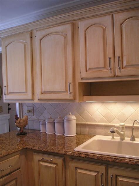 Want to update your kitchen cabinets without blowing your budget? repaint our kitchen cabinets in a linen white with a glaze ...