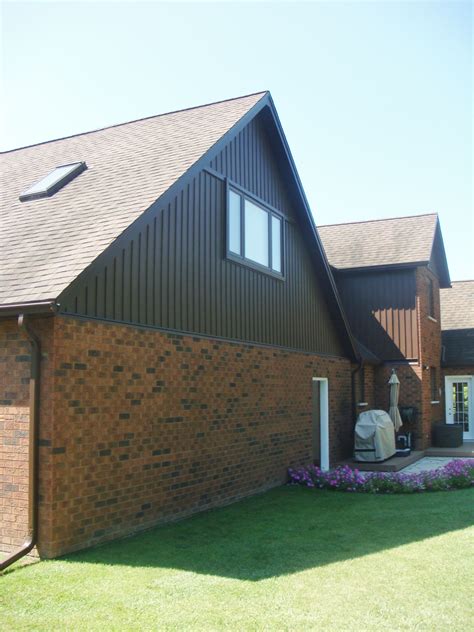 Aluminum Soffit, Fascia and Trough with Cocoa Vinyl board & Batten