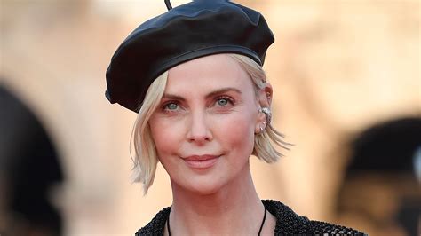 Charlize Theron Stuns In Swimsuit Under See Through Mesh Dress Teasing