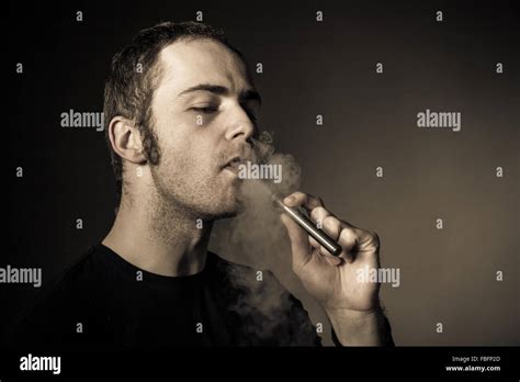 Man Smokes Electronic Cigarette Stock Photo Alamy