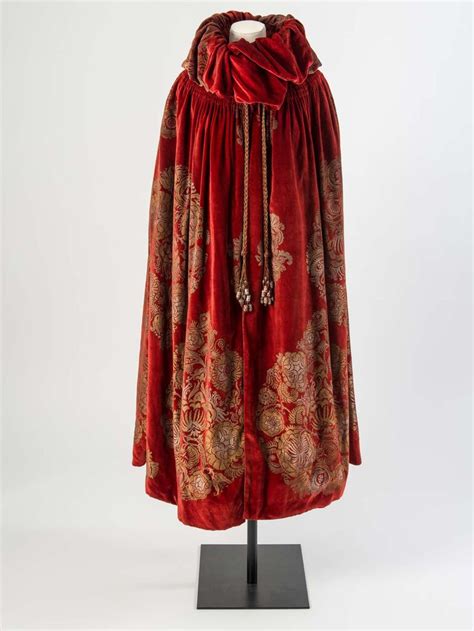 Maybe you would like to learn more about one of these? Dark red velvet cloak with a gold and silver stencilled ...
