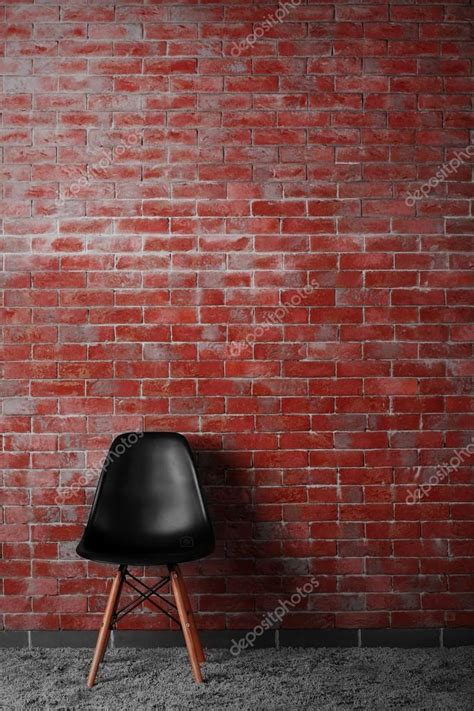 Modern Chair On Brick Wall — Stock Photo © Belchonock 91888934