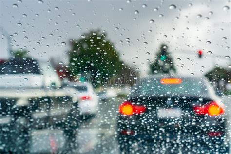 Raindrops On The Windshield On A Rainy Day Cars Stopped At A Traffic