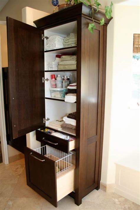 The standard height measures 32 inches. Bathroom Storage Tower With Hamper | Tall bathroom storage ...