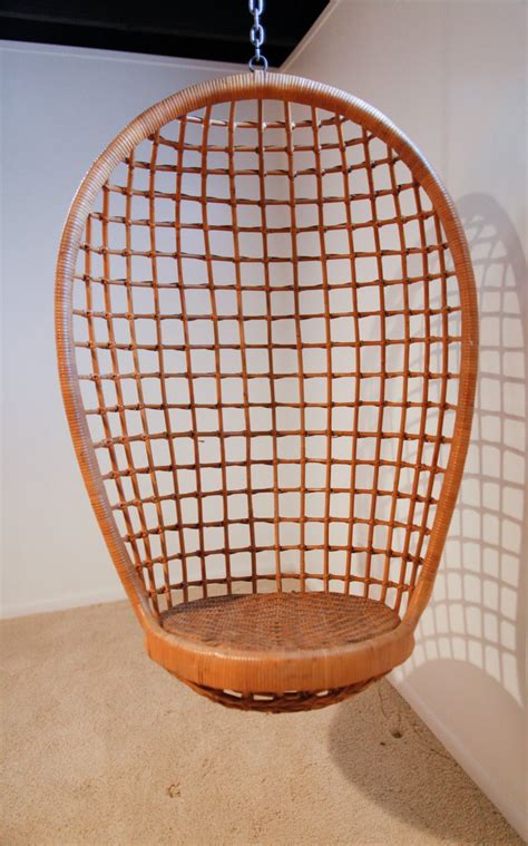 Chair legs are made of black lacquered metal. Rattan Hanging Egg Chair, Mid-Century image 3