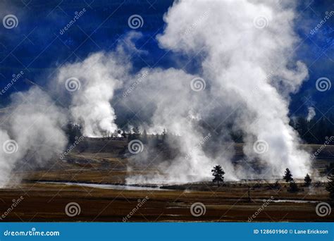 Geysers And Steam Rising In Yellowstone National Park Stock Photo