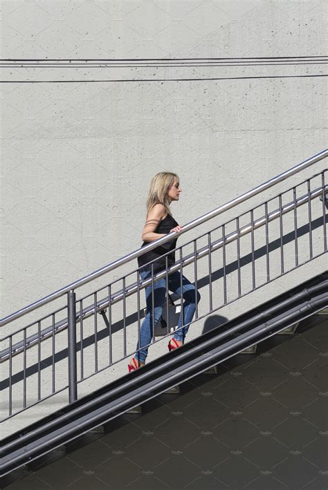Blonde Woman Walking Up Stairs Outdo People Images ~ Creative Market