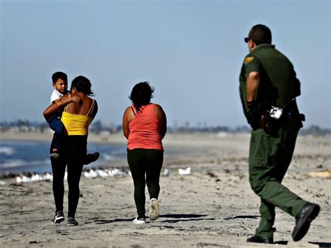 Watch Caravan Migrants Seek Asylum After Crossing Under Border Wall