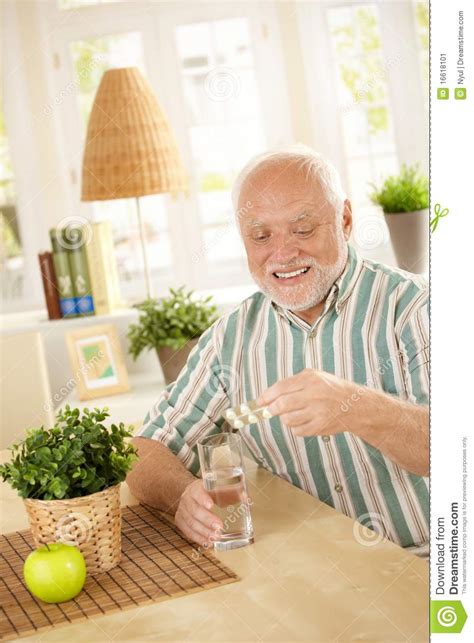 Smiling Old Man Taking Medication Stock Image Image