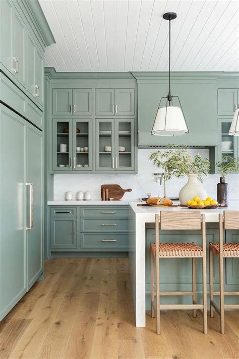 Sage Green Kitchen Cabinets With White Marble Slab Backsplash