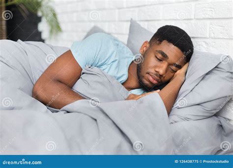 Young African American Man Sleeping In Bed At Home Stock Image Image