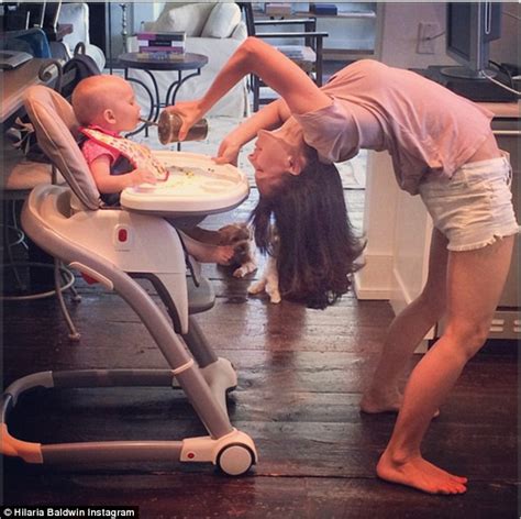 Hilaria Baldwin Shows Off Lean Figure In Yoga Pose Feeding Daughter Upside Down Daily Mail Online