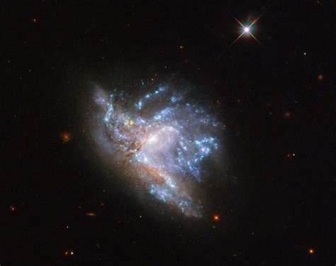 Spectacular Galaxy Collision Captured By Hubble Ngc 6052 Scinews