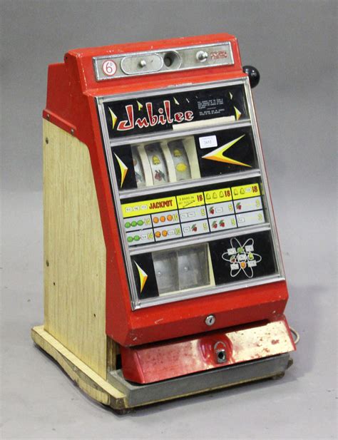 A Jubilee International One Armed Bandit Sixpenny Slot Machine Finished In Red Height 66cm Width
