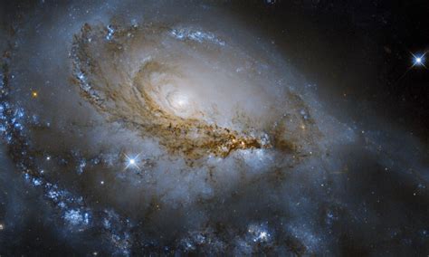 Hubble Sees A Spiral Galaxy With A Supermassive Black Hole Feasting At