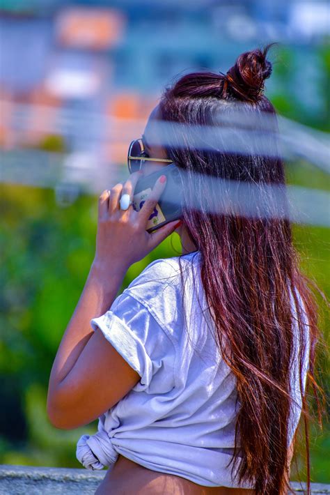 A Long Hair Girl Attending A Phone Call Pixahive