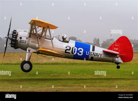 A 1930s Boeing Stearman Model 75 Biplane In Us Navy Colors Comes In For