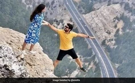 Couple Poses On Cliffs Edge In Viral Pic That Has People Baffled