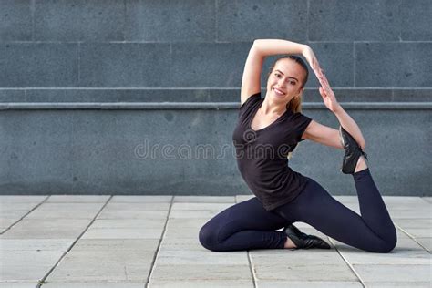 Stretching Fit Or Dancer Or Fitness Woman Doing Exercise Stock Photo