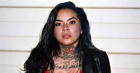 female gang member with neck and chest tattoos dubbed next hot felon after mugshot goes viral