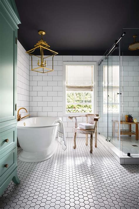 white tile  dark grout dark ceiling spa shower freestanding tub
