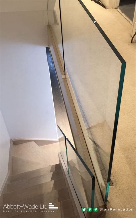 Stained Oak Staircase With Frameless Glass Balustrade Waiting For New