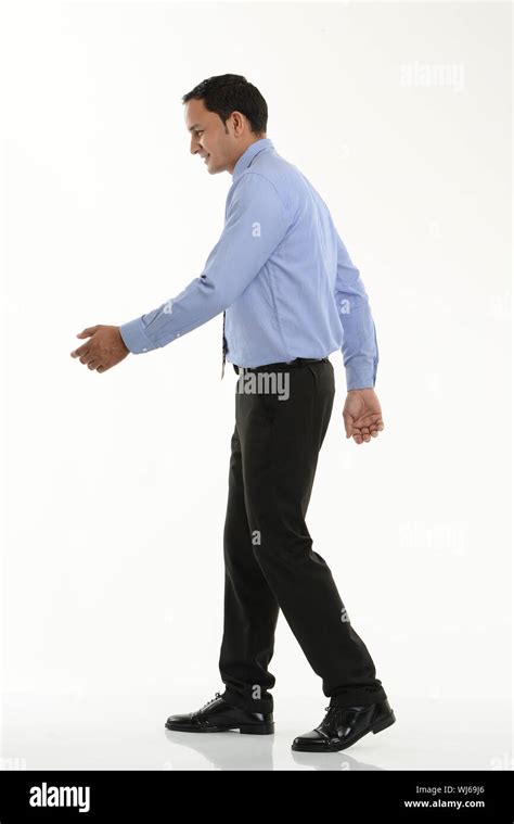 Side Profile Of A Businessman Walking Stock Photo Alamy