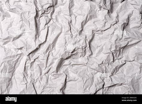 Crumpled Gray Paper Texture Wrinkled Paper Background With Cracks And Kinks Stock Photo Alamy