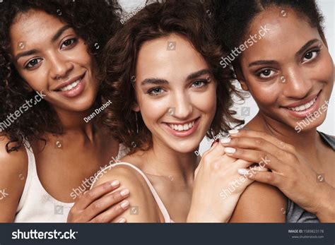 Portrait Three Happy Multiethnic Women Hugging Stock Photo 1589823178