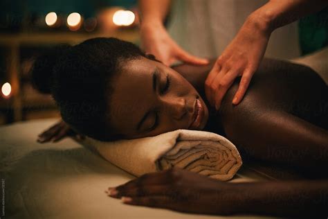African Woman Enjoying A Massage By Stocksy Contributor Lumina