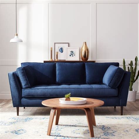 This living room layout relies on the unconventional use of a deep blue color on the walls, highlighted and accented by bold, ornate. Navy Blue Sofa: A Promising Piece To Be Bold & Stylish for ...