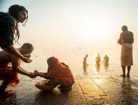 Indian Pilgrim Doing His Morning Prayers In The River Ganges In Varanasi Uttar Pradesh India