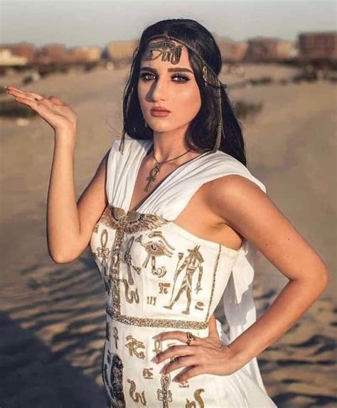Egyptian Woman Wearing A Dress And Accessories Inspired By The Clothes Of Her Ancient Egyptian