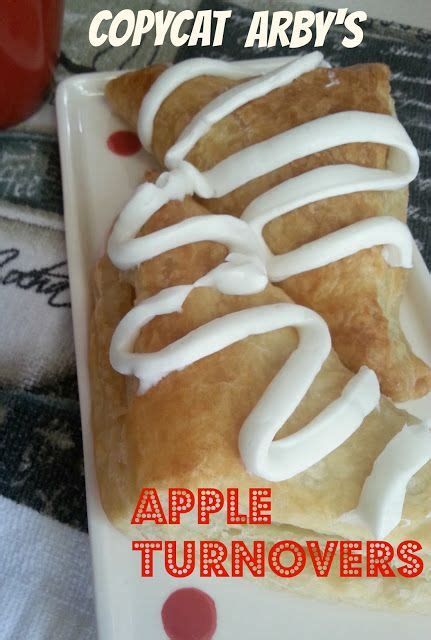 An Apple Turnover With White Icing On It