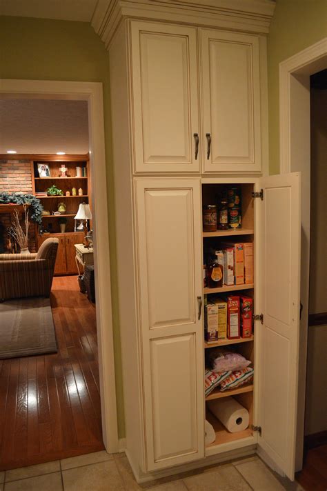 Position the other shelves at the points where the cabinet doors meet. Why You Might Want a Kitchen Pantry Cabinet in Your Home ...
